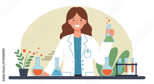 Cheerful female scientist in lab coat holding test tube with green liquid.