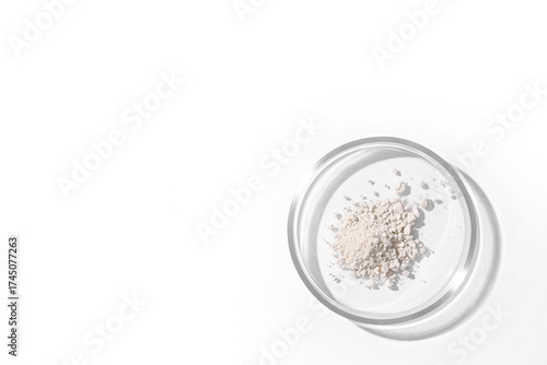 Petri dish with powder on w...