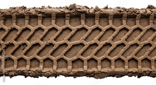 Muddy tire track imprinted on ground detailed hexagonal pattern
