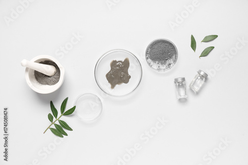 Petri dish with different samples on grey background