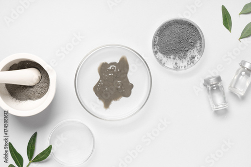 Petri dish with different samples on grey background