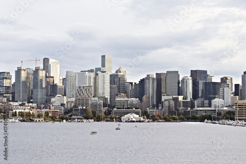 Downtown Seattle skyline viewed from Lake Union, featuring modern skyscrapers and waterfront architecture under soft daylight in the Pacific Northwest.