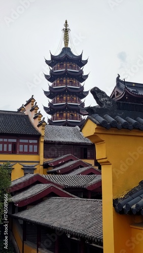 ancient traditional yellow wooden pagoda and old chinese temple buildings