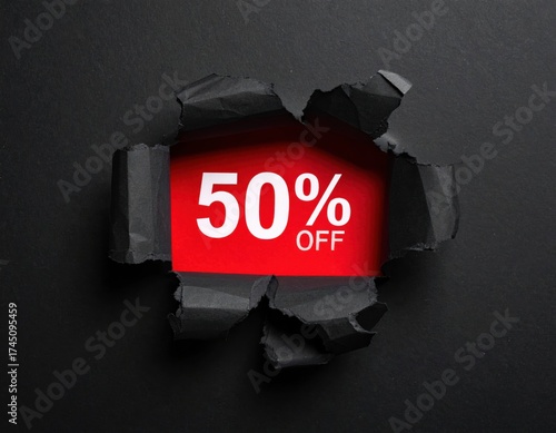 Black paper is dramatically torn open, revealing a bright red background displaying a prominent fifty percent off sale.