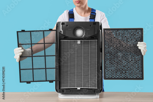 Female technician changing ...