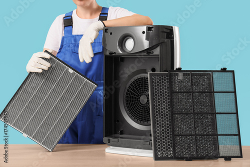 Female technician changing ...