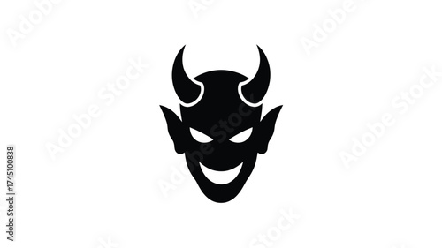 Silhouette of a grinning devil face with sharp horns and glowing eyes