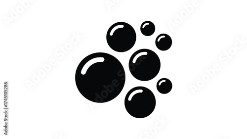 Abstract pattern of glossy black liquid droplets on a clean white background