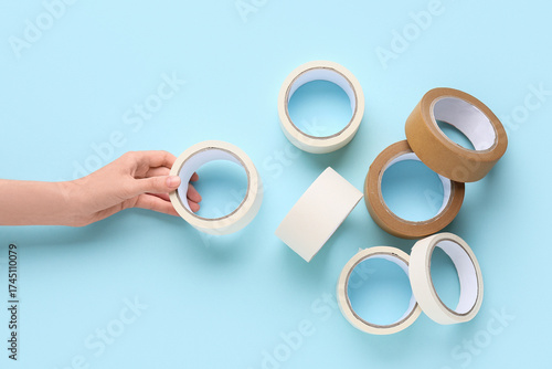 Female hand with rolls of d...