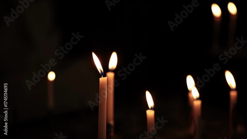 Wallpaper Mural Group of burning stick candles against pitch black background. Close up shot, real time, no people Torontodigital.ca