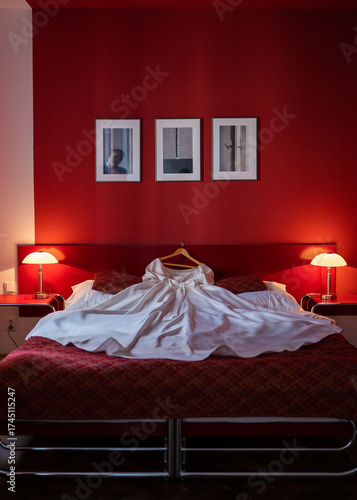 interior of a modern hotel room, wedding day. wedding dress on bed