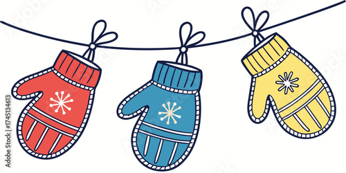 Colorful winter mittens hanging on a string with bows  