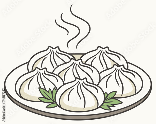 Steaming khinkali on a plate with fresh herbs  