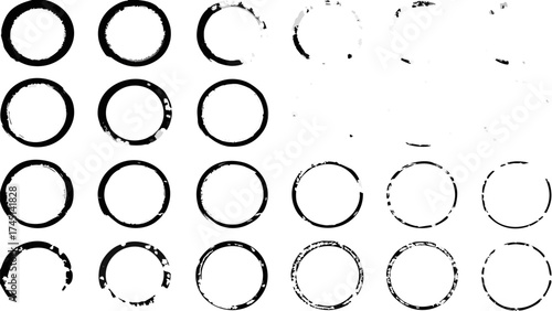Collection of black circle rings with varying degrees of grunge and incompleteness displayed on white