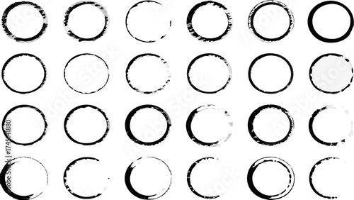 A collection of twenty four black and white circle shapes with varying levels of imperfections and textures