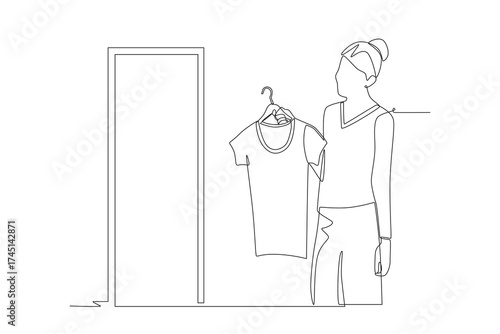 Woman trying on clothes before buying them. Shoping trying on clothes concept one-line drawing