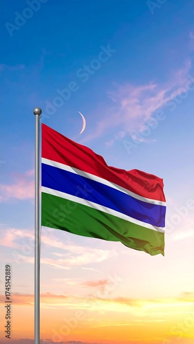 Gambia flag waving in a vibrant sunrise/sunset sky