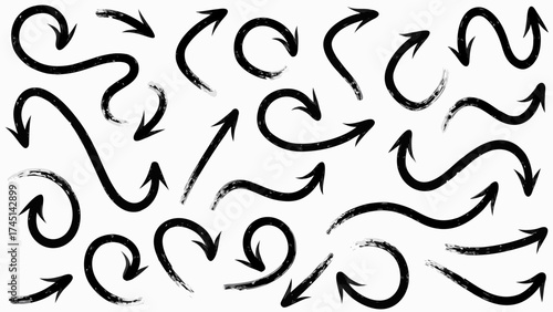 Collection of black hand drawn arrows pointing in different directions on a white background surface