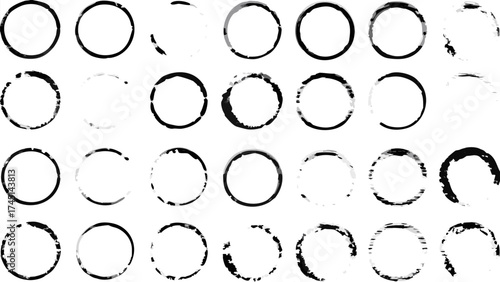 Collection of thirty distressed black circle shapes arranged in a grid pattern on white background