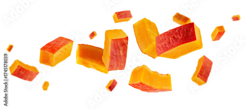 Rectangular slices of red pumpkin fly and levitate in space. Isolated on white.