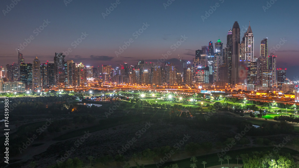 Fototapeta premium Dubai Marina skyscrapers and golf course day to night timelapse, Dubai, United Arab Emirates