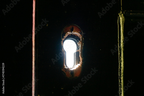 close up broken door keyhole