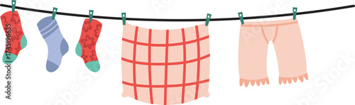 Laundry drying on clothesline with socks and underwear