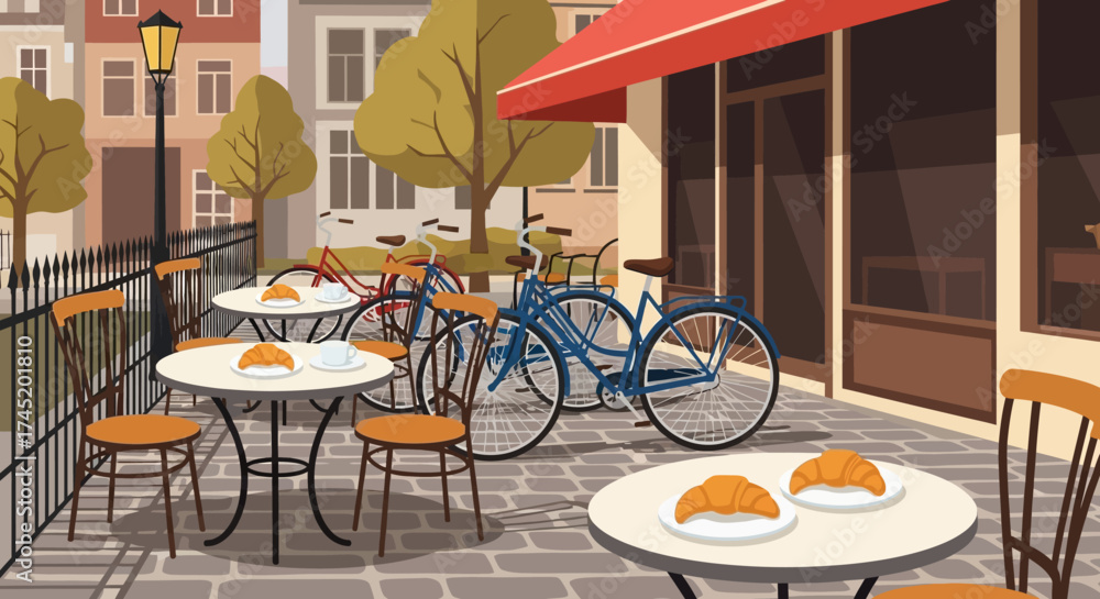 Obraz premium Cafe scene with tables and chairs, bicycles parked outside.