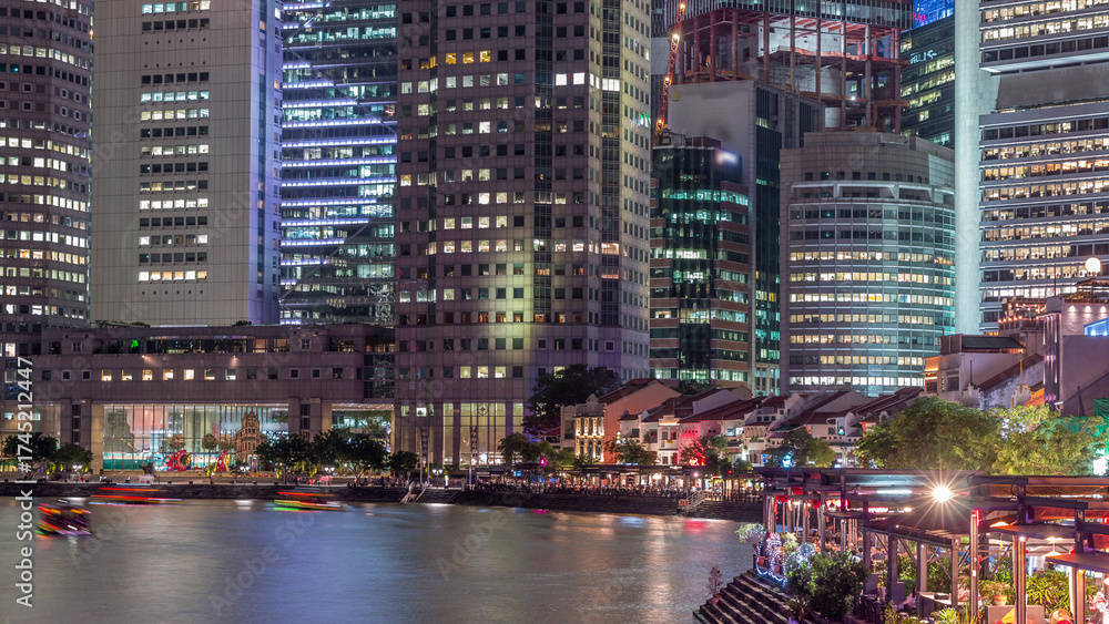 Naklejka premium Singapore quay with tall skyscrapers in the central business district on Boat Quay day to night timelapse
