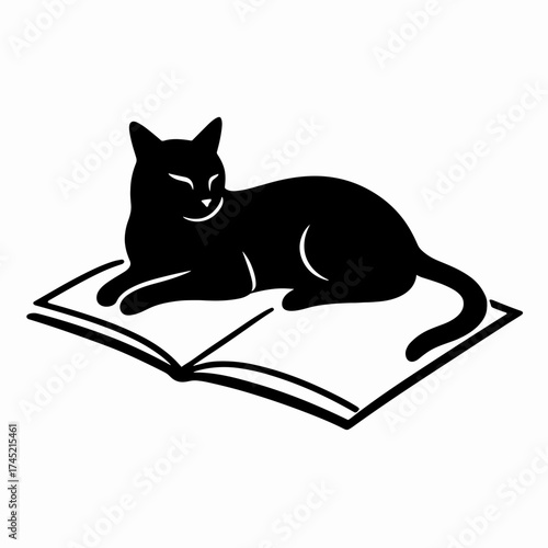 Cat lying on open notebook 