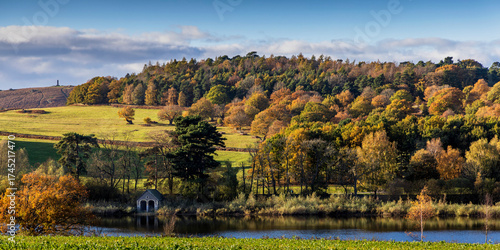 View of Bradgate Park across Cropston reservoir in autumn, Leicestershire, England