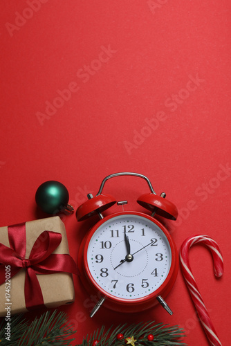 Festive scene with wrapped gifts, candies and decorations, sometimes on a bright red background, conveying Christmas greetings and celebration
