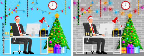 Man in santa hat at desk with laptop. Business office decorated for New Year eve holiday celebration. Corporate party.