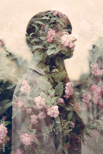 Silhouette of a girl against a background of rose flowers