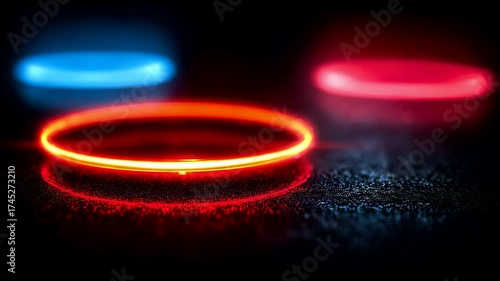 Glowing neon rings in red and blue colors on dark reflective surface creating vibrant abstract composition with depth and contrast