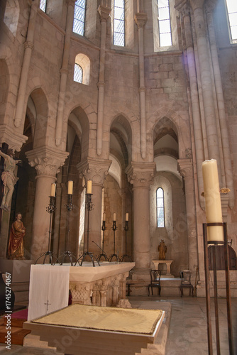 View of the altar in the Alcobaca Monastery with rounded arches and natural light in a heritage and religious setting