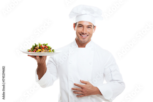 Smiling male chef in uniform holding a plate of salad isolated on transparent background
