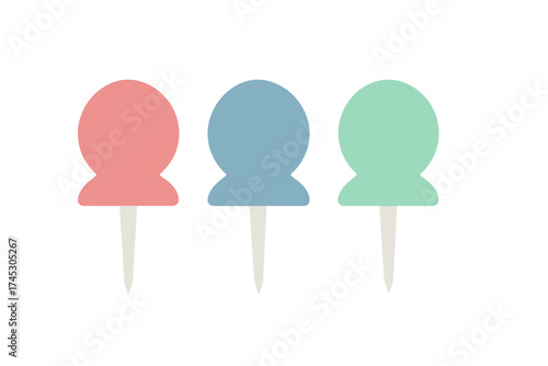 Three colorful pushpins used for organization and marking important locations