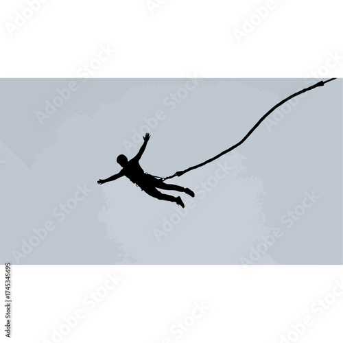 Silhouette of a person bungee jumping from a high place.
