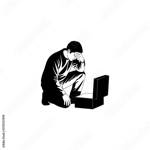 Man kneeling with head in hand looking into an open box in black and white art silhouette