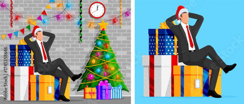 Man wearing santa hat sitting on stack of Christmas gift boxes with a Christmas tree. New Year holiday celebration and gift delivery concept.