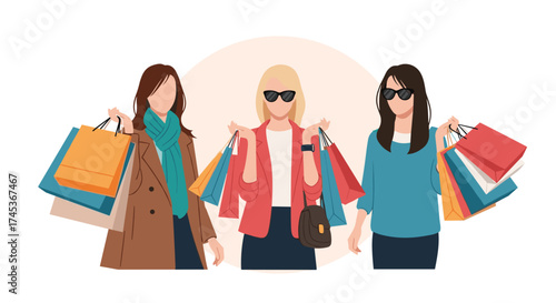 Three women holding shopping bags in a mall.