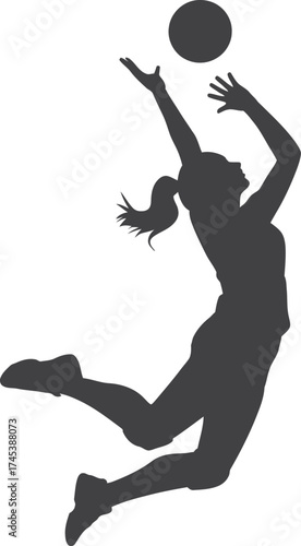 Silhouette of a female volleyball player spiking the ball during a game