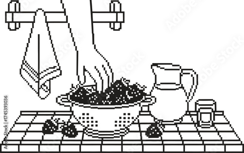 Hand washing fresh strawberries in a colander on a checkered surface