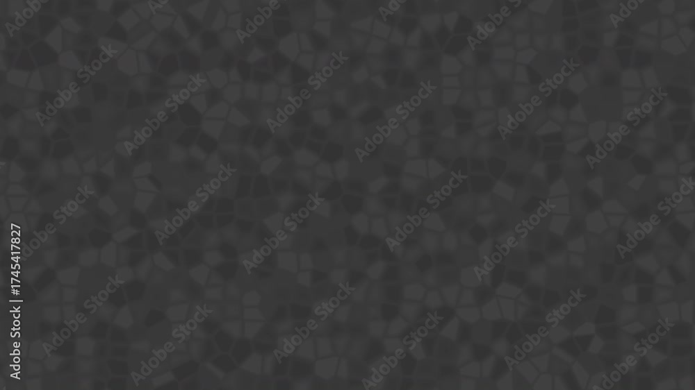 Elegant dark gray animation featuring a faceted crystalline surface that moves smoothly, creating the illusion of shifting crystal fragments. The irregular polygonal shapes reflect light subtly.