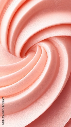 Close-up of creamy pink swirled frosting, showcasing its smooth texture and soft curves, ideal for desserts