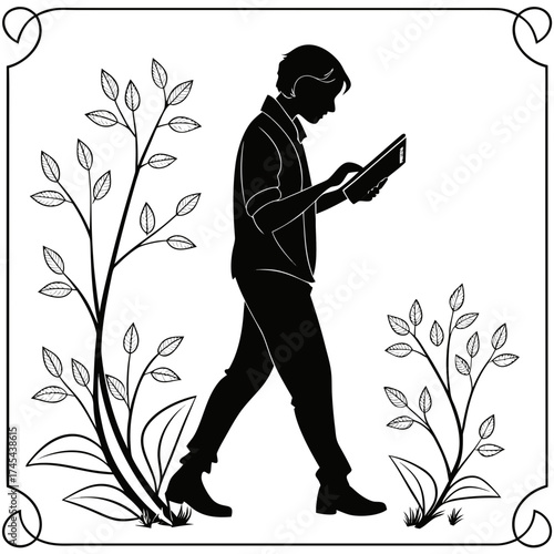 Silhouette of a young man walking and looking at a tablet computer surrounded by decorative branches with leaves