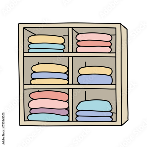 Folded towels organized in a wooden shelf in pastel colors  