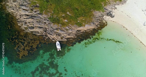 Empty boat anchored in blue sea top view from drone as vacation concept background