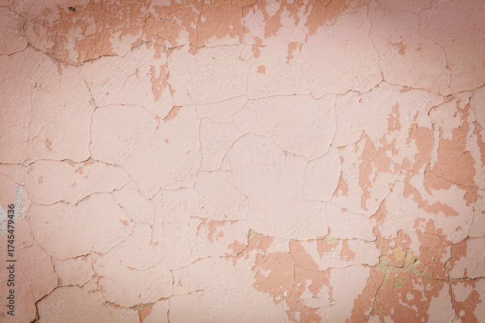Obraz premium A wall with a lot of cracks and holes